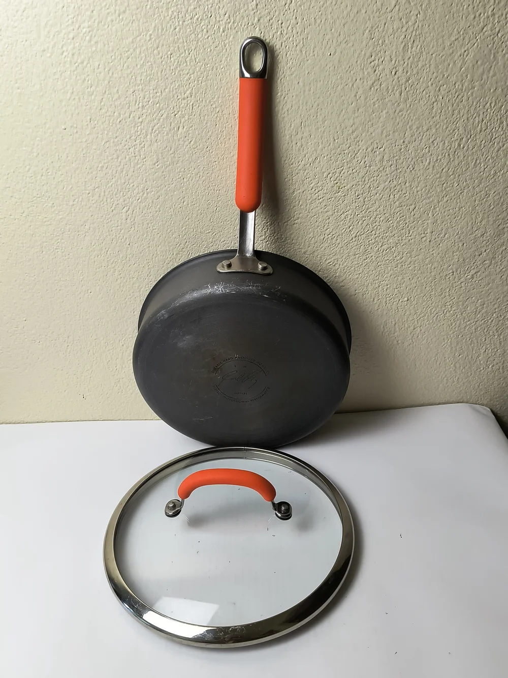 Rachael Ray 3QR/2.8L Black Sauté Pan with Orange Silicone Handle and Lid Grip